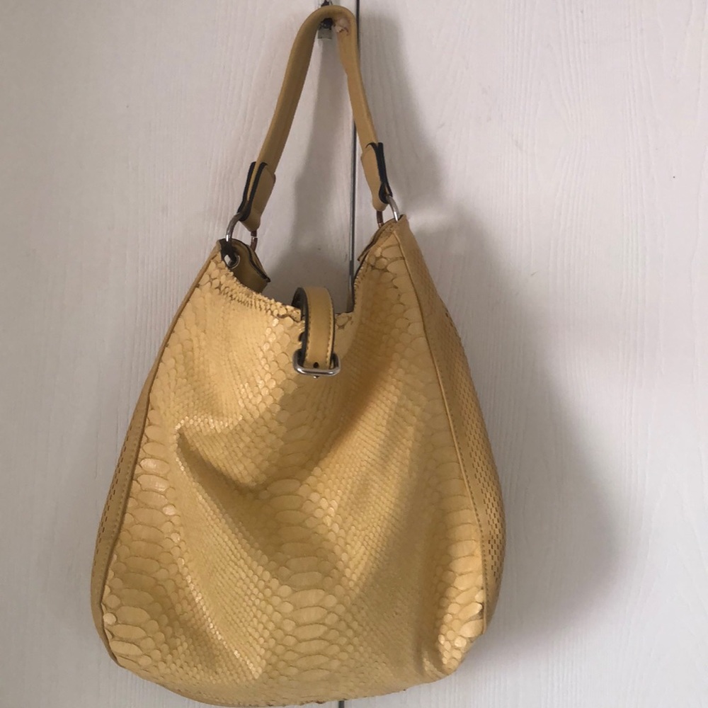 Woman’s yellow  urban expressions purse